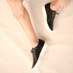 Image 2 of the Everyday Sneaker Black on model