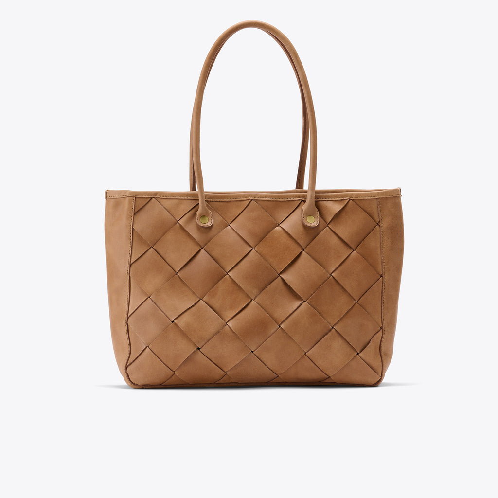 The Leila tote is the perfect on-the-go bag. With its neutral